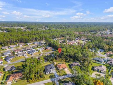 This 3-bedroom, 2-bath home in Palm Coast, is full of potential on The Grand Club Cypress Course in Florida - for sale on GolfHomes.com, golf home, golf lot