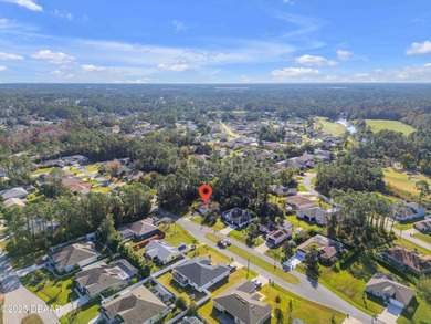 This 3-bedroom, 2-bath home in Palm Coast, is full of potential on The Grand Club Cypress Course in Florida - for sale on GolfHomes.com, golf home, golf lot