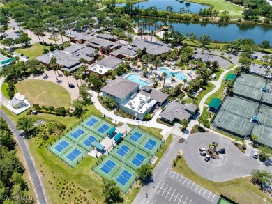 Nestled up to stunning waterfront and golf course views in the on Miromar Lakes Golf Club in Florida - for sale on GolfHomes.com, golf home, golf lot