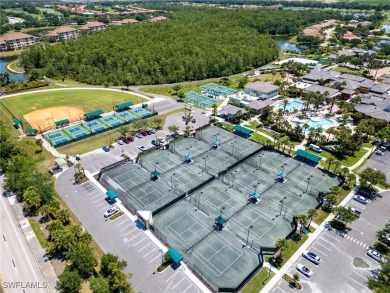 Nestled up to stunning waterfront and golf course views in the on Miromar Lakes Golf Club in Florida - for sale on GolfHomes.com, golf home, golf lot