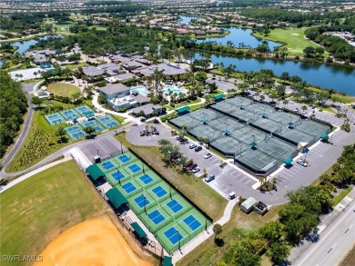 Nestled up to stunning waterfront and golf course views in the on Miromar Lakes Golf Club in Florida - for sale on GolfHomes.com, golf home, golf lot