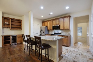 Experience the ultimate lock-and-leave lifestyle in this on TPC At Craig Ranch in Texas - for sale on GolfHomes.com, golf home, golf lot