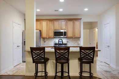 Experience the ultimate lock-and-leave lifestyle in this on TPC At Craig Ranch in Texas - for sale on GolfHomes.com, golf home, golf lot