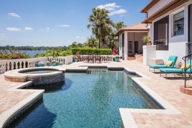 Experience refined lakefront living in this exceptional estate on Isleworth Golf and Country Club in Florida - for sale on GolfHomes.com, golf home, golf lot