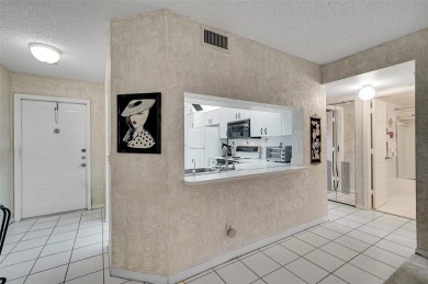 Sunrise Lakes Community Offers this Active 55+ Lakefront Condo on Sunrise Lakes Phase IV Golf Course in Florida - for sale on GolfHomes.com, golf home, golf lot