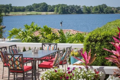 Experience refined lakefront living in this exceptional estate on Isleworth Golf and Country Club in Florida - for sale on GolfHomes.com, golf home, golf lot