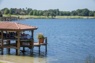 Experience refined lakefront living in this exceptional estate on Isleworth Golf and Country Club in Florida - for sale on GolfHomes.com, golf home, golf lot