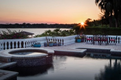 Experience refined lakefront living in this exceptional estate on Isleworth Golf and Country Club in Florida - for sale on GolfHomes.com, golf home, golf lot