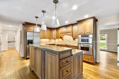 Exquisite traditional brick estate in the prestigious North on North Ridge Country Club in North Carolina - for sale on GolfHomes.com, golf home, golf lot