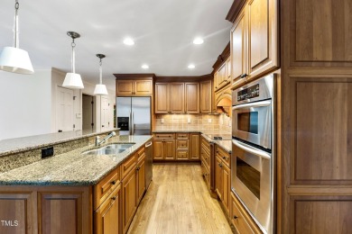Exquisite traditional brick estate in the prestigious North on North Ridge Country Club in North Carolina - for sale on GolfHomes.com, golf home, golf lot