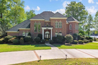 Welcome to this exquisite lakefront home in a gated golf course on Carolina Trace Country Club in North Carolina - for sale on GolfHomes.com, golf home, golf lot