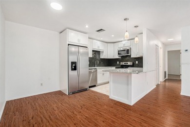 Fully remodeled and move-in ready -- bring on the offers! This on Highland Lakes Executive Golf Course in Florida - for sale on GolfHomes.com, golf home, golf lot