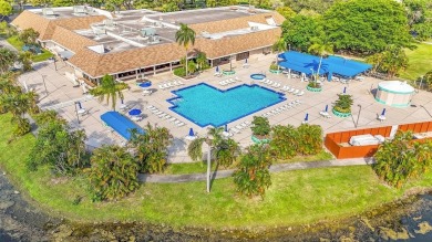 Sunrise Lakes Community Offers this Active 55+ Lakefront Condo on Sunrise Lakes Phase IV Golf Course in Florida - for sale on GolfHomes.com, golf home, golf lot