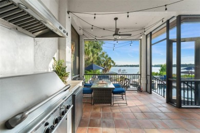 Motivated Seller - Experience refined lakefront living in this on Isleworth Golf and Country Club in Florida - for sale on GolfHomes.com, golf home, golf lot