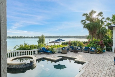 Motivated Seller - Experience refined lakefront living in this on Isleworth Golf and Country Club in Florida - for sale on GolfHomes.com, golf home, golf lot