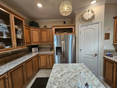 This meticulously cared-for home is as beautiful inside as it is on Big Cypress Golf and Country Club in Florida - for sale on GolfHomes.com, golf home, golf lot