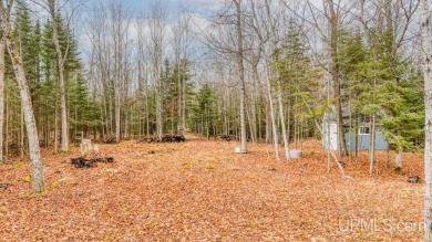 This 1.84-acre lot offers 237 feet of frontage on Lake on Nahma Club in Michigan - for sale on GolfHomes.com, golf home, golf lot