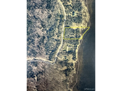 This 1.84-acre lot offers 237 feet of frontage on Lake on Nahma Club in Michigan - for sale on GolfHomes.com, golf home, golf lot