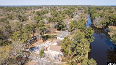 Don't miss out on this incredible canal-front home situated on on Duck Woods Country Club in North Carolina - for sale on GolfHomes.com, golf home, golf lot