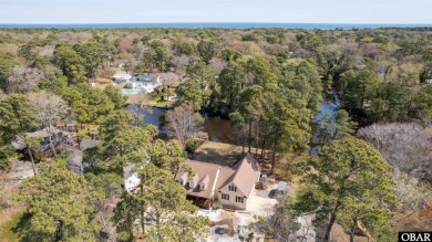 Don't miss out on this incredible canal-front home situated on on Duck Woods Country Club in North Carolina - for sale on GolfHomes.com, golf home, golf lot