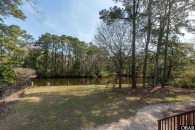 Don't miss out on this incredible canal-front home situated on on Duck Woods Country Club in North Carolina - for sale on GolfHomes.com, golf home, golf lot