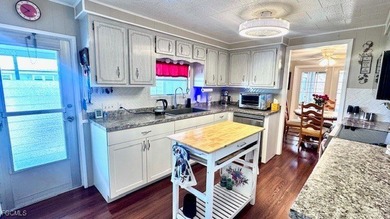 Welcome to your dream waterfront home in the premier 55+ gated on Riverbend Golf and Country Club in Florida - for sale on GolfHomes.com, golf home, golf lot