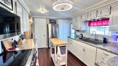 Welcome to your dream waterfront home in the premier 55+ gated on Riverbend Golf and Country Club in Florida - for sale on GolfHomes.com, golf home, golf lot