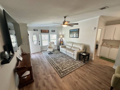 A beautiful remodeled home done in 2022! As you arrive at the on Del Tura Golf and Country Club in Florida - for sale on GolfHomes.com, golf home, golf lot