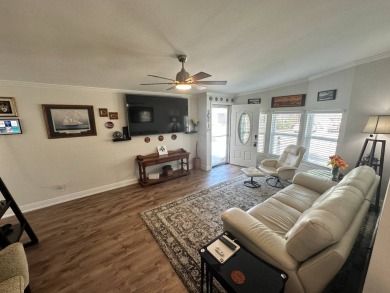 A beautiful remodeled home done in 2022! As you arrive at the on Del Tura Golf and Country Club in Florida - for sale on GolfHomes.com, golf home, golf lot