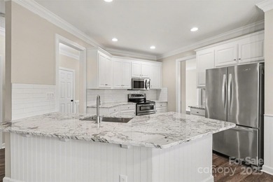 Updated 5-bedroom, 2.5-bath home located in the Highland Creek on Highland Creek Golf Club in North Carolina - for sale on GolfHomes.com, golf home, golf lot