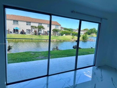 Discover serenity on this first floor lake view apartment on Fontainebleau Golf Course in Florida - for sale on GolfHomes.com, golf home, golf lot