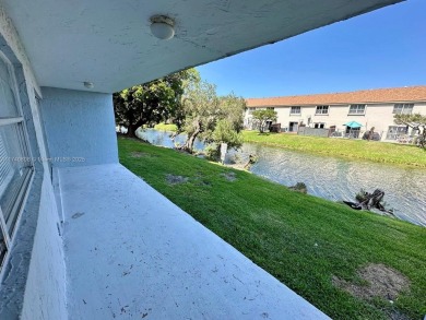 Discover serenity on this first floor lake view apartment on Fontainebleau Golf Course in Florida - for sale on GolfHomes.com, golf home, golf lot