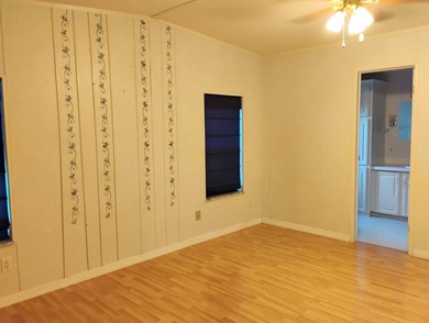 Over 1200 sq. ft. of comfortable living with a 1 car garage on Ocala Palms Golf and Country Club in Florida - for sale on GolfHomes.com, golf home, golf lot