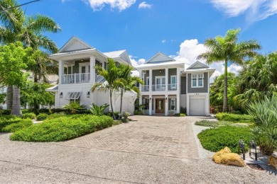 Custom waterfront residence just a short walk to the Gulf of on Key Royale Club in Florida - for sale on GolfHomes.com, golf home, golf lot