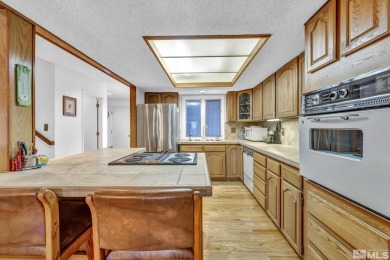 Love where you live in this beautifully maintained end-unit on LakeRidge Golf Course in Nevada - for sale on GolfHomes.com, golf home, golf lot