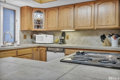 Love where you live in this beautifully maintained end-unit on LakeRidge Golf Course in Nevada - for sale on GolfHomes.com, golf home, golf lot