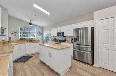 Welcome home to this INCREDIBLY WELL MAINTAINED and FEELS LIKE on Kings Gate Golf Club in Florida - for sale on GolfHomes.com, golf home, golf lot