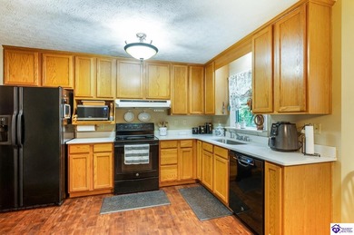 This inviting 3-bedroom, 2-bath ranch home is nestled among on Doe Valley Country Club in Kentucky - for sale on GolfHomes.com, golf home, golf lot