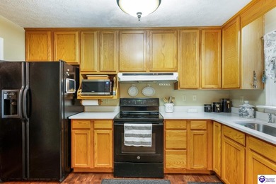 This inviting 3-bedroom, 2-bath ranch home is nestled among on Doe Valley Country Club in Kentucky - for sale on GolfHomes.com, golf home, golf lot