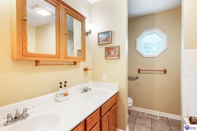 This inviting 3-bedroom, 2-bath ranch home is nestled among on Doe Valley Country Club in Kentucky - for sale on GolfHomes.com, golf home, golf lot