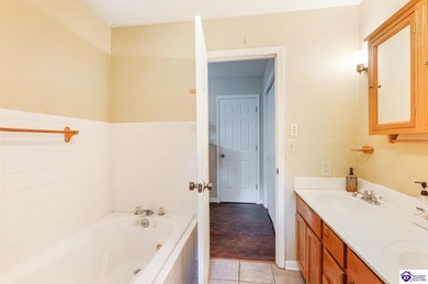 This inviting 3-bedroom, 2-bath ranch home is nestled among on Doe Valley Country Club in Kentucky - for sale on GolfHomes.com, golf home, golf lot