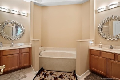 This beautifully maintained 3-bedroom, 2-bath villa with a 2-car on Eagle Marsh Golf Club in Florida - for sale on GolfHomes.com, golf home, golf lot