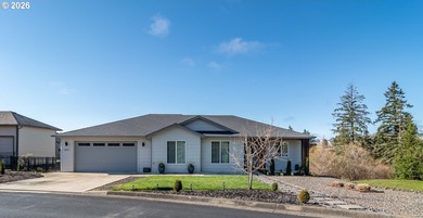 Experience gorgeous sunset views overlooking the 17th hole and on Oak Hills Golf Club / Umpqua Golf Resort in Oregon - for sale on GolfHomes.com, golf home, golf lot