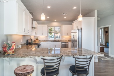 Experience gorgeous sunset views overlooking the 17th hole and on Oak Hills Golf Club / Umpqua Golf Resort in Oregon - for sale on GolfHomes.com, golf home, golf lot