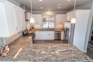 Experience gorgeous sunset views overlooking the 17th hole and on Oak Hills Golf Club / Umpqua Golf Resort in Oregon - for sale on GolfHomes.com, golf home, golf lot