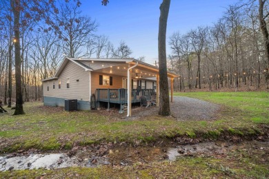 Welcome to your dream home! This 3-4 bedroom house is nestled in on Diamondhead Golf and Country Club in Arkansas - for sale on GolfHomes.com, golf home, golf lot