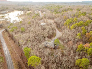 Welcome to your dream home! This 3-4 bedroom house is nestled in on Diamondhead Golf and Country Club in Arkansas - for sale on GolfHomes.com, golf home, golf lot