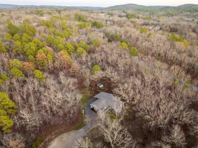 Welcome to your dream home! This 3-4 bedroom house is nestled in on Diamondhead Golf and Country Club in Arkansas - for sale on GolfHomes.com, golf home, golf lot