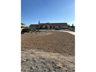 This is a beautiful custom built Spanish Style Home.  This home on Apple Valley Country Club in California - for sale on GolfHomes.com, golf home, golf lot