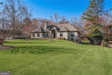 Resort-style living awaits in this beautifully appointed on Royal Lakes Golf and Country Club in Georgia - for sale on GolfHomes.com, golf home, golf lot